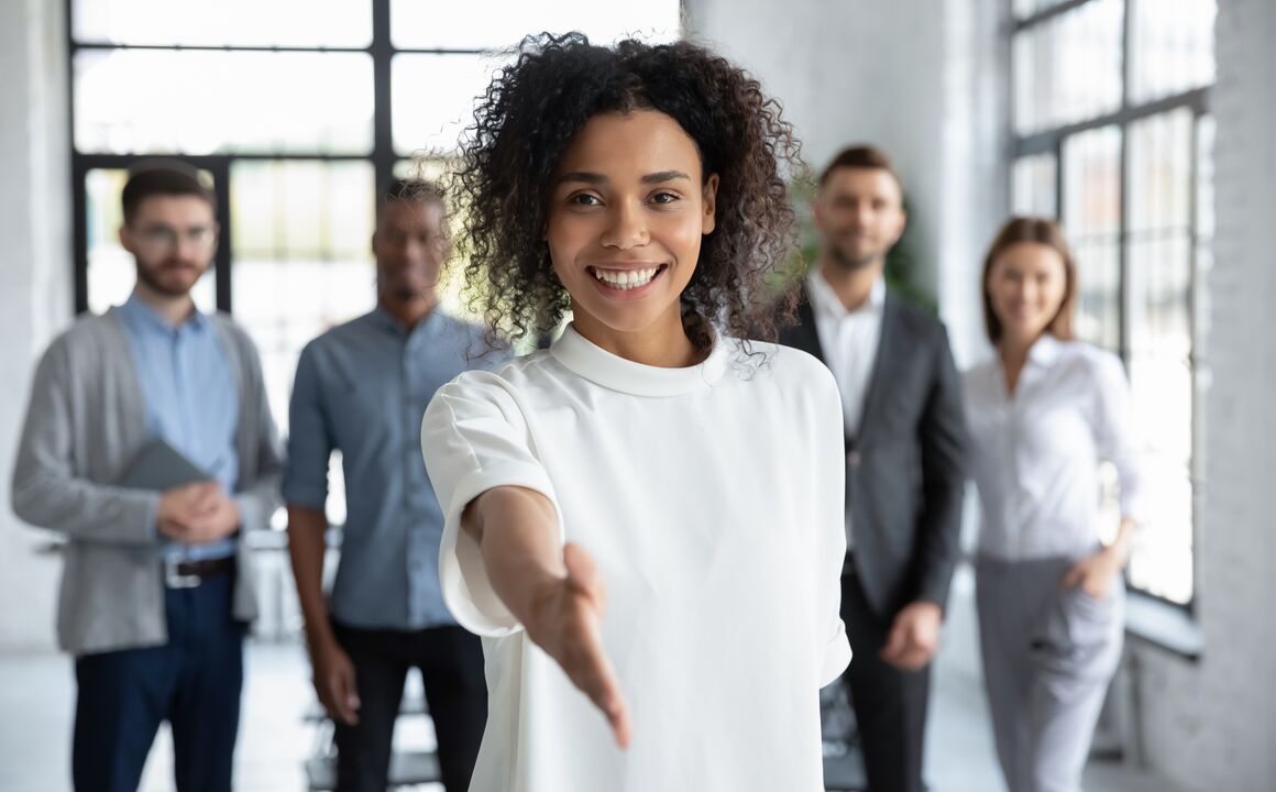A woman holding her hand out to shake